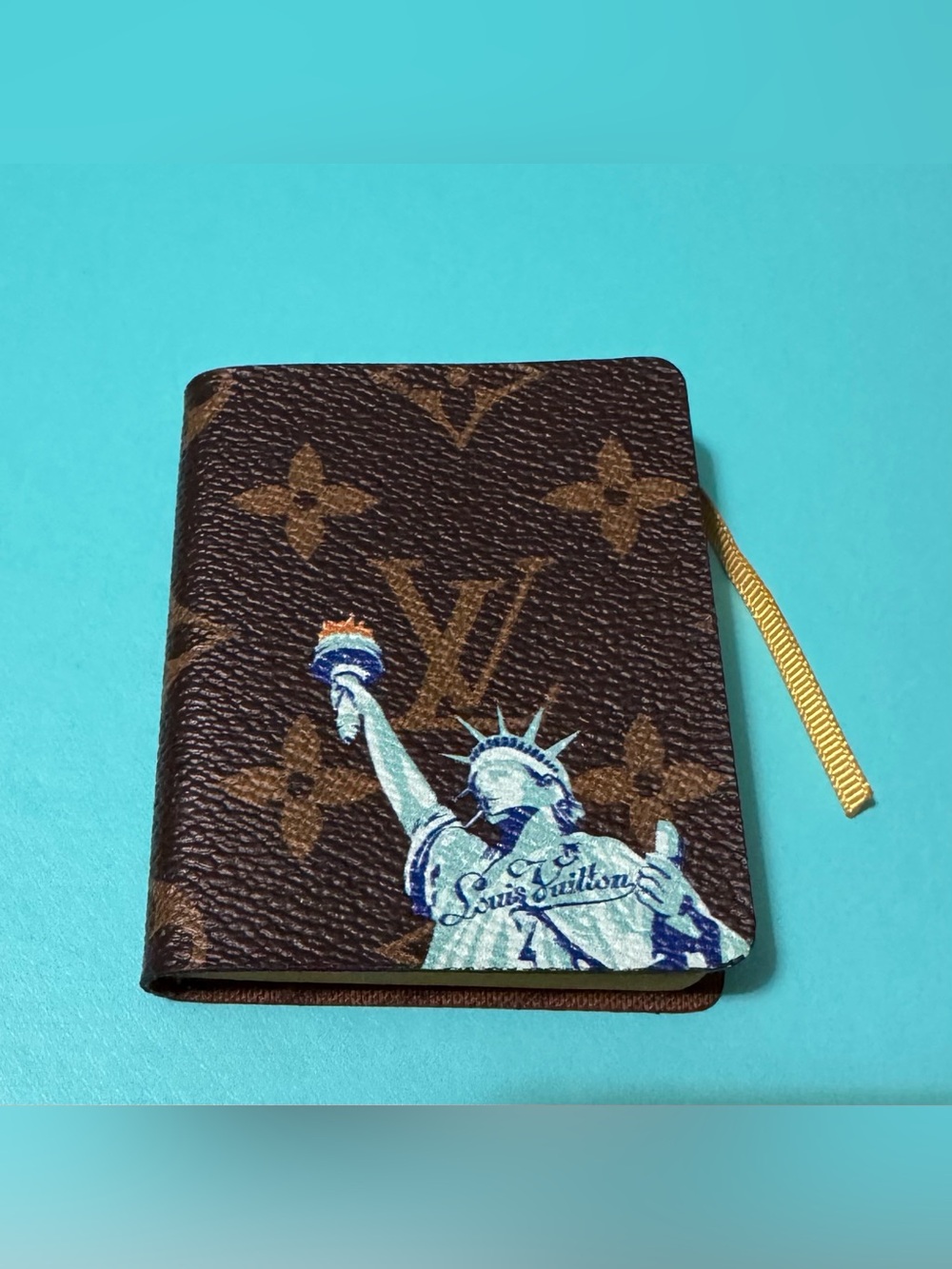 Louis Vuitton Brown Monogram Passport Cover with Blue-Cream Statue Motif